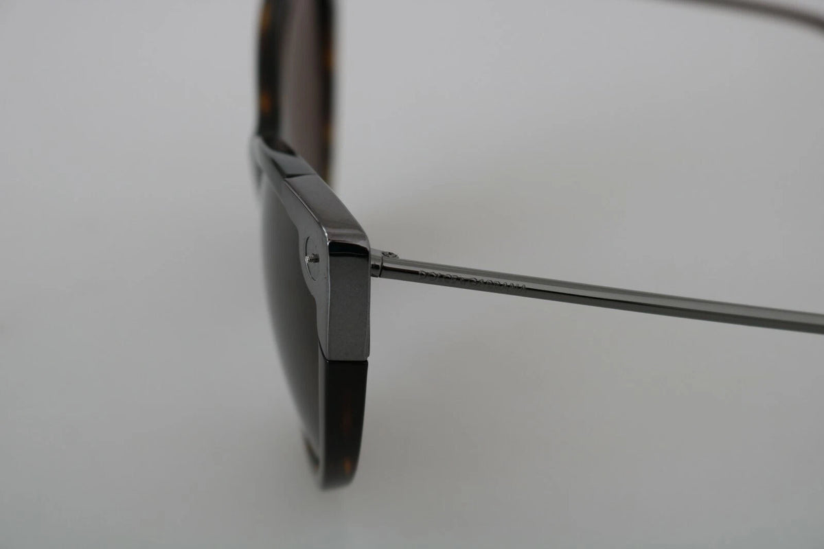 Indulge in the exquisite Dolce & Gabbana DG4337 Dark Havana Cat Eye Sunglasses, a timeless blend of Italian artistry and luxurious sophistication, perfect for elevating any ensemble.