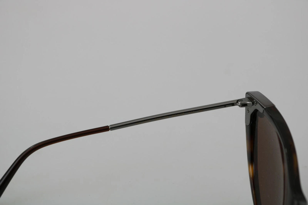 Indulge in the exquisite Dolce & Gabbana DG4337 Dark Havana Cat Eye Sunglasses, where Italian craftsmanship meets timeless elegance, perfect for elevating any ensemble.