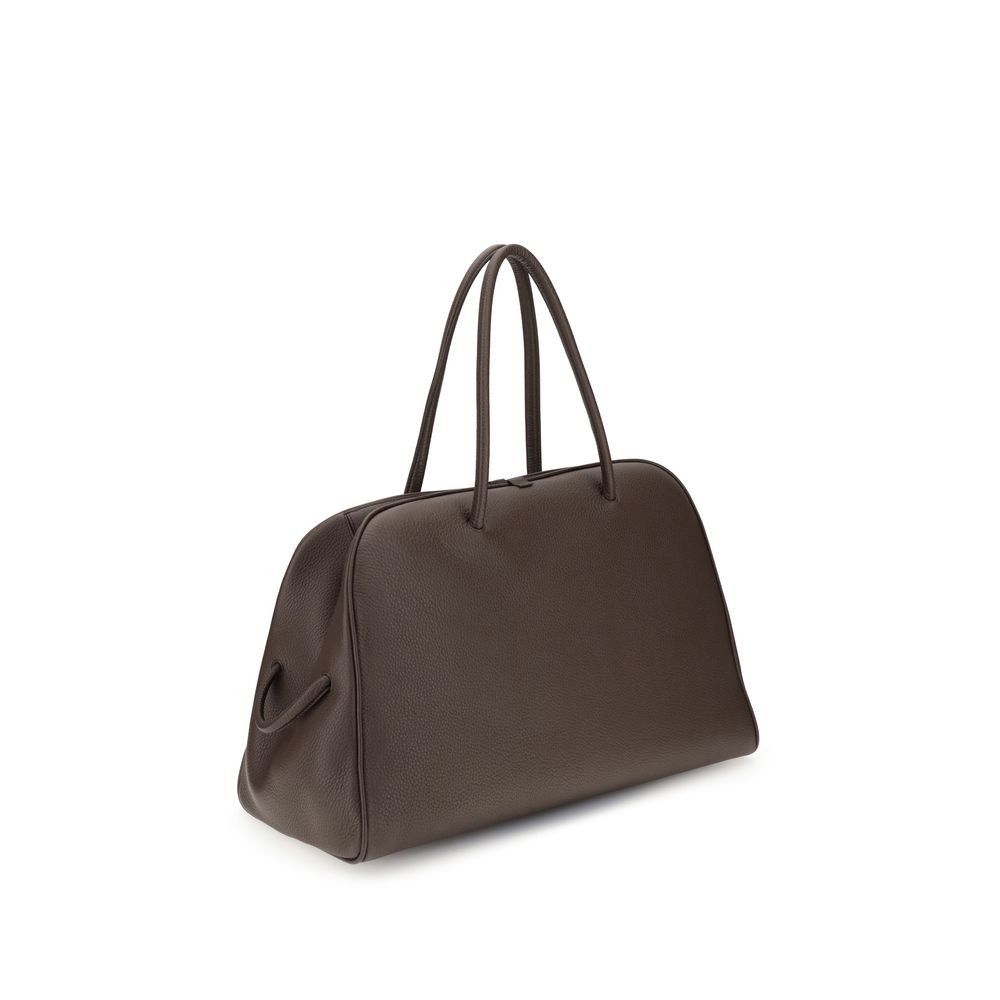Indulge in the Jacquemus Brown Calf Leather Bos Taurus Handbag, a luxurious blend of exquisite craftsmanship and modern elegance, perfect for the discerning individual.