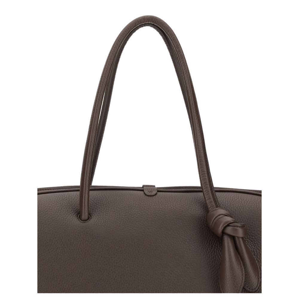Indulge in the Jacquemus Brown Calf Leather Bos Taurus Handbag, a masterpiece of exquisite craftsmanship that redefines luxury with its modern bowling bag silhouette.