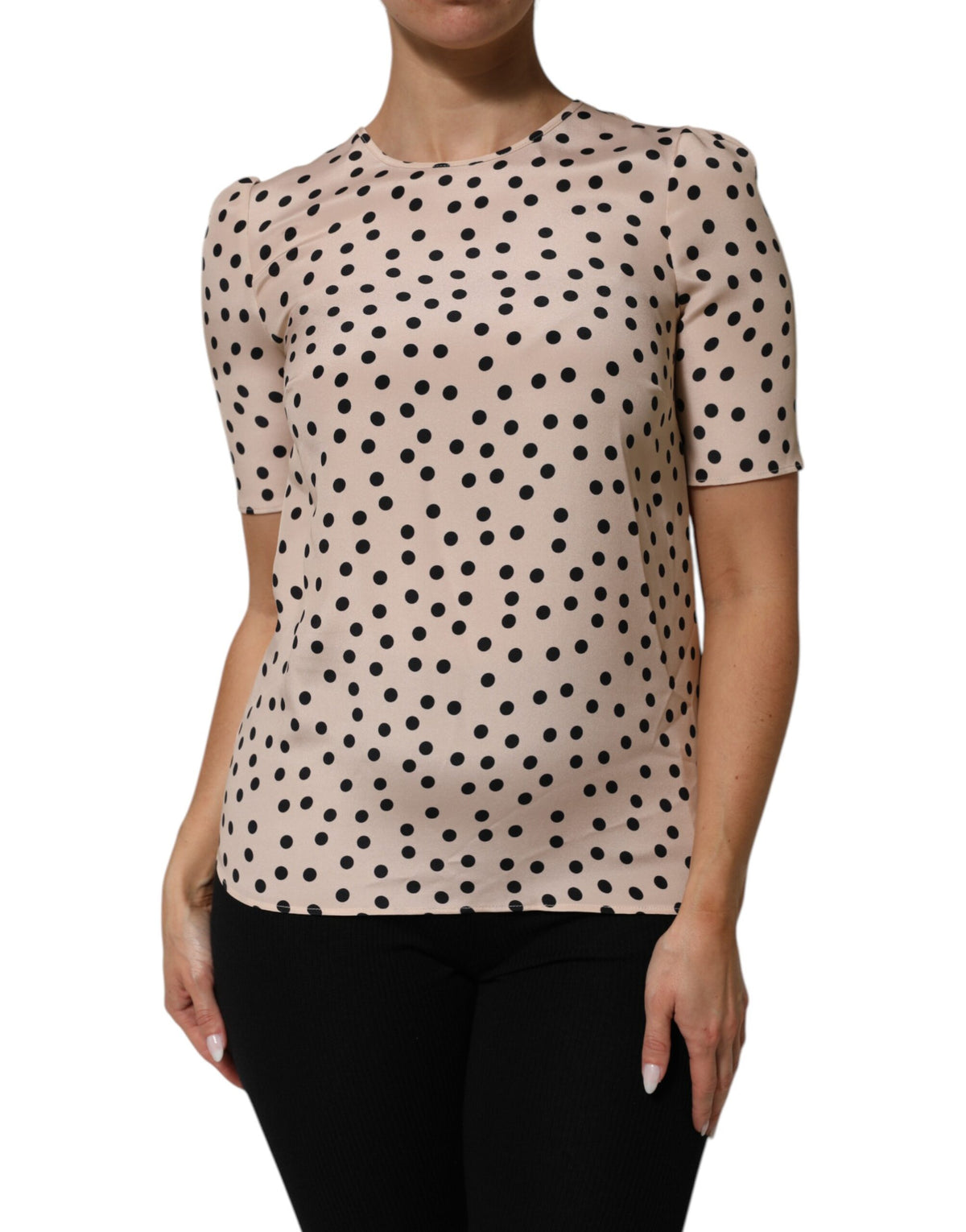 Indulge in the exquisite Dolce & Gabbana Beige Black Polka Dot Silk Blouse, a masterpiece of Italian craftsmanship that embodies timeless elegance and playful sophistication.