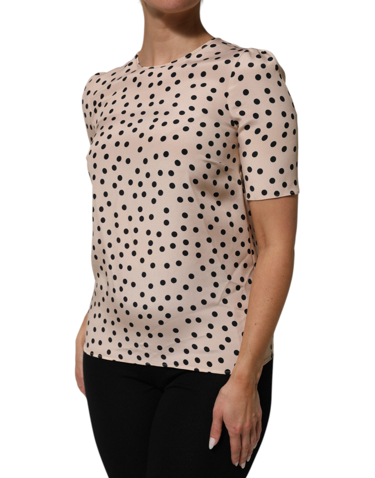 Elevate your wardrobe with the Dolce & Gabbana Beige Black Polka Dot Silk Blouse, a masterpiece of Italian craftsmanship that embodies timeless elegance and playful sophistication.