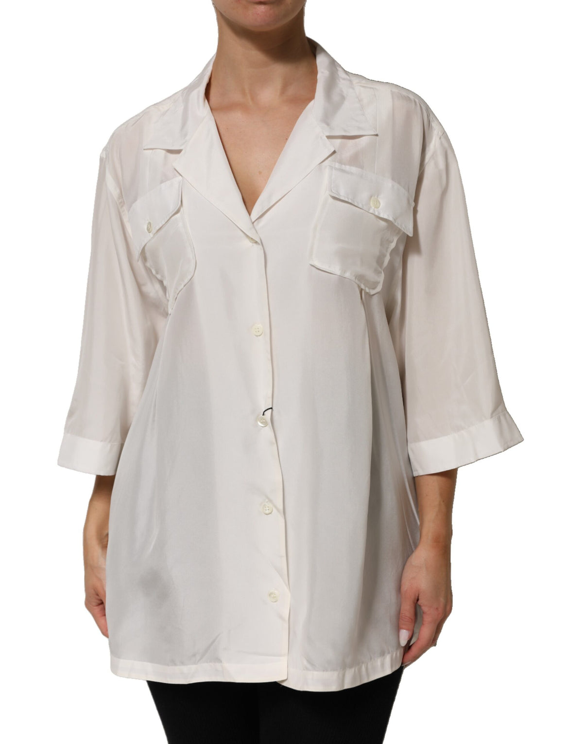 Elevate your wardrobe with the Dolce & Gabbana White Silk Collared Blouse, a masterpiece of Italian craftsmanship that embodies timeless elegance and sophisticated allure.