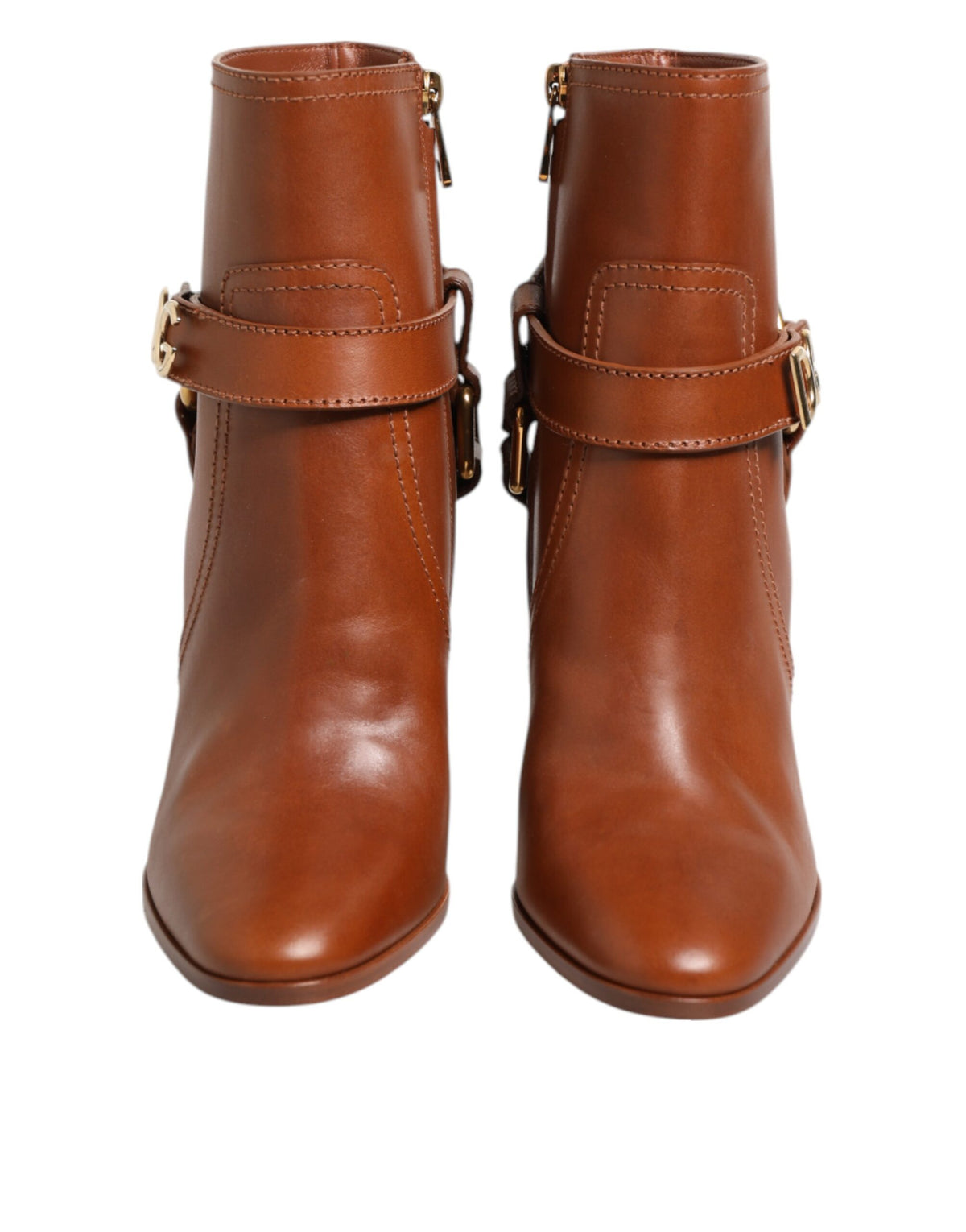 Indulge in the exquisite Dolce & Gabbana Brown Leather DG Logo Buckle Ankle Boots, where luxurious calf leather meets unparalleled craftsmanship, embodying timeless elegance for the discerning individual.