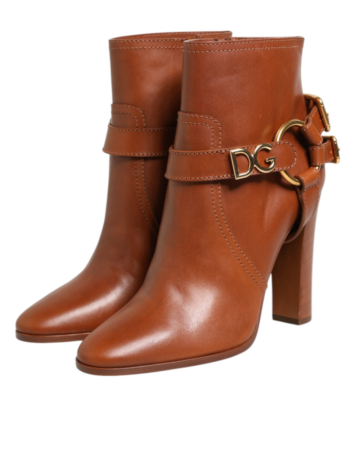 Indulge in the exquisite Dolce & Gabbana Brown Leather DG Logo Buckle Ankle Boots, crafted from luxurious calf leather, embodying sophistication and timeless elegance for the discerning individual.