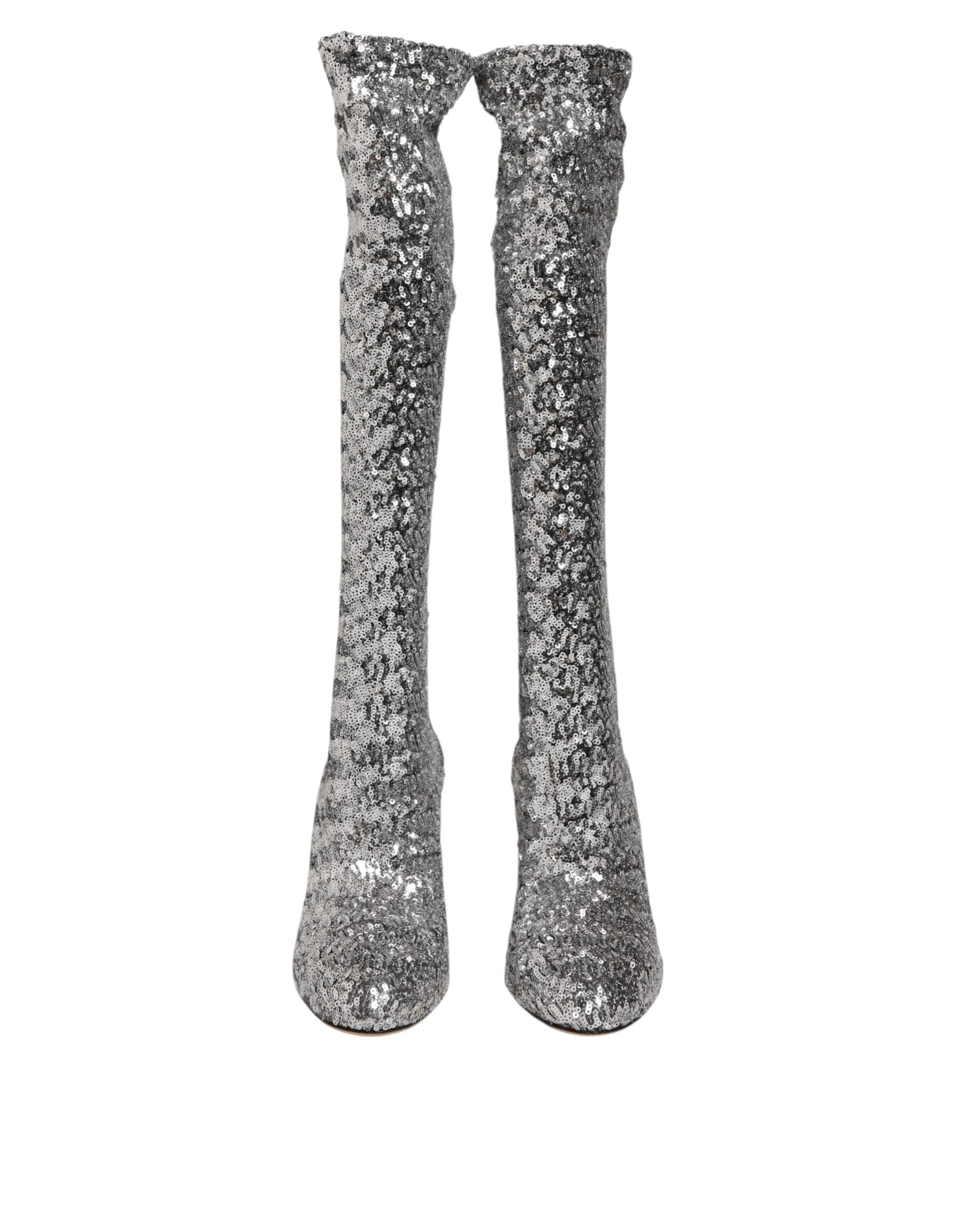 Indulge in the allure of Dolce & Gabbana's Silver Sequins High Heel Boot, a masterpiece of Italian craftsmanship that elevates your style with luxurious elegance and sensuality.