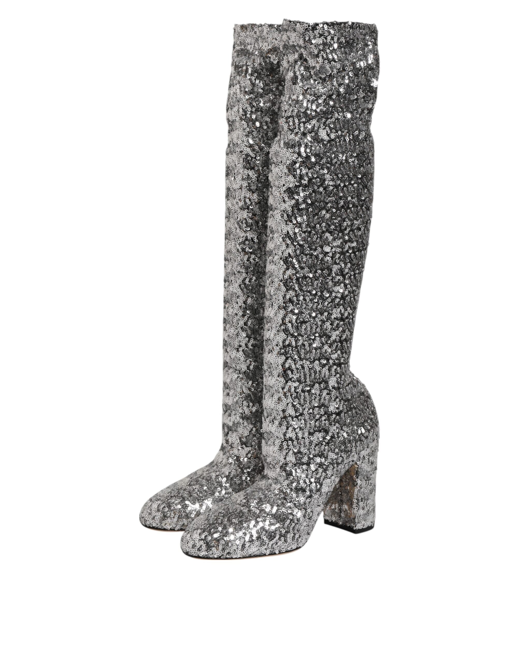 Indulge in the exquisite allure of Dolce & Gabbana's Silver Sequins High Heel Boot, a testament to Italian craftsmanship and sensual elegance, perfect for unforgettable moments.