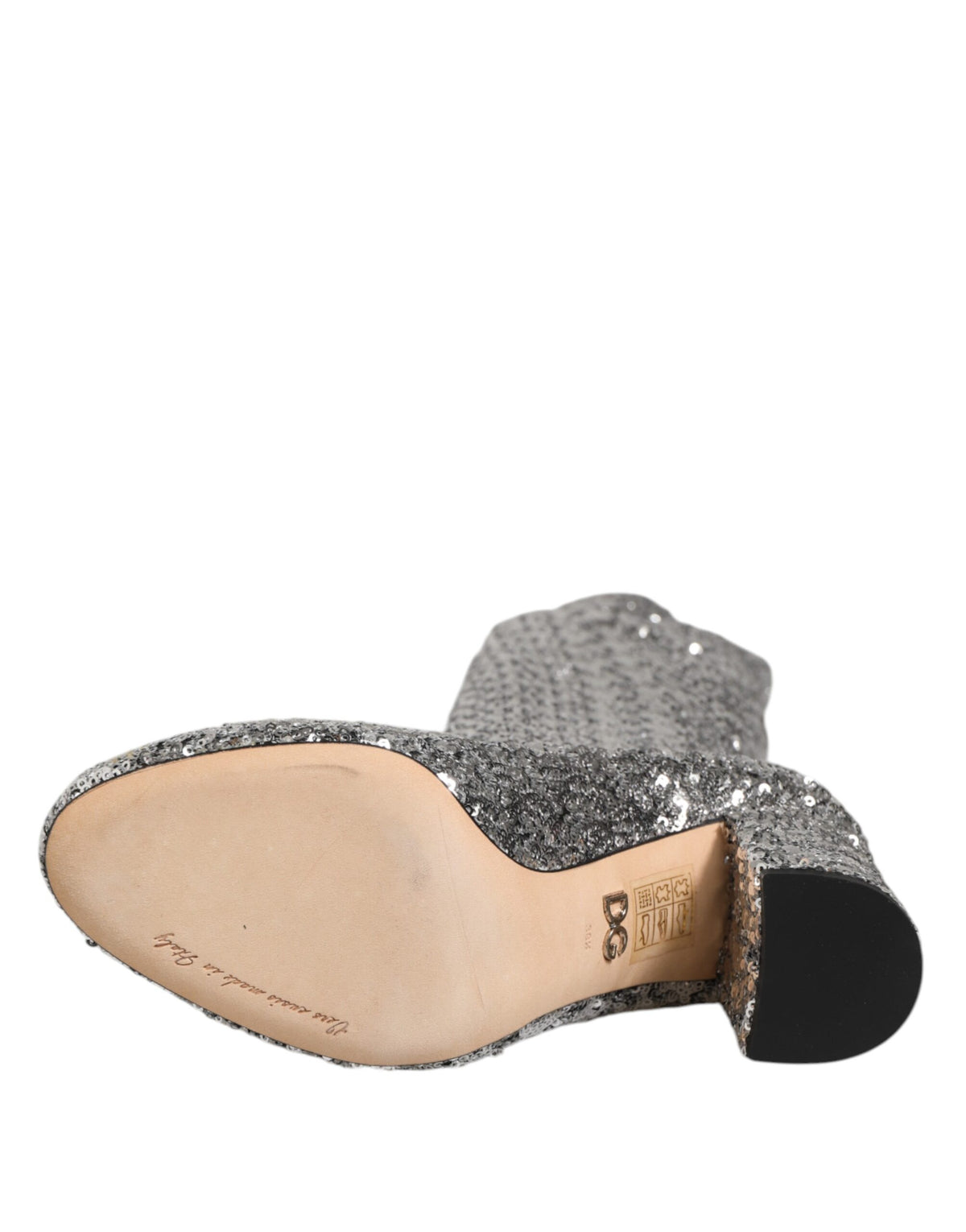 Step into the allure of Dolce & Gabbana's Silver Sequins High Heel Boot, where exquisite craftsmanship meets modern elegance, perfect for the discerning individual.