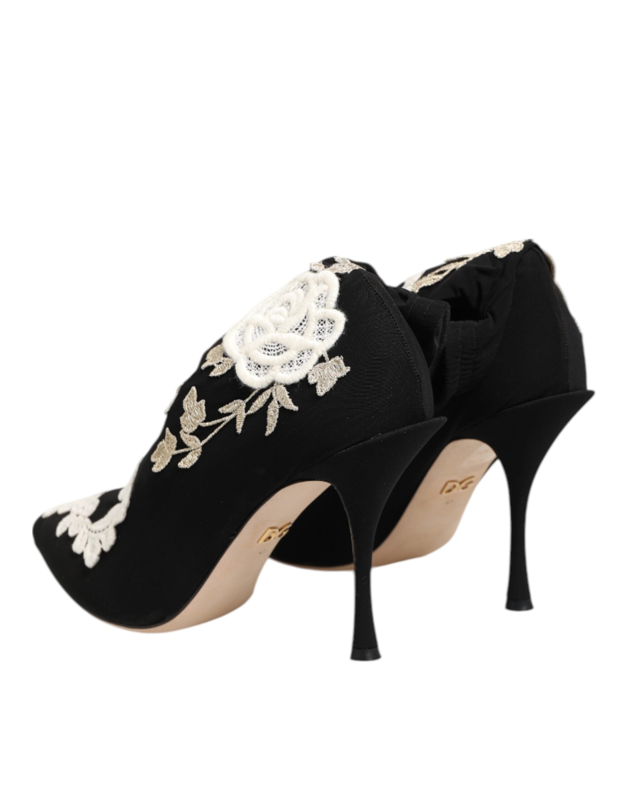 Elevate your style with Dolce & Gabbana's Black White Embroidered Jersey Stiletto Boots, where exquisite craftsmanship meets modern elegance for the discerning fashionista.