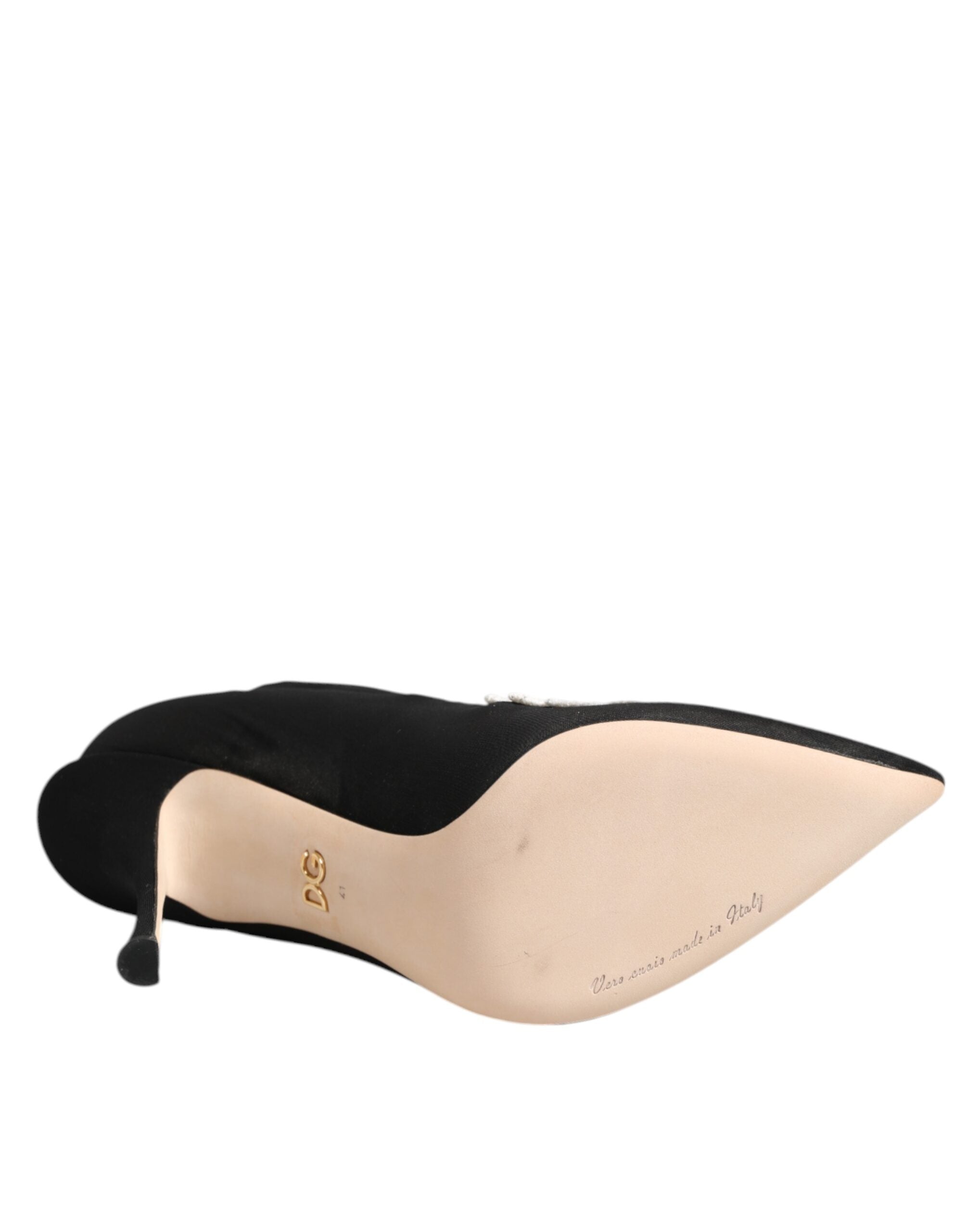 Experience the allure of Dolce & Gabbana's Black White Embroidered Jersey Stiletto Boots, where exquisite craftsmanship meets luxurious design for the discerning fashionista.