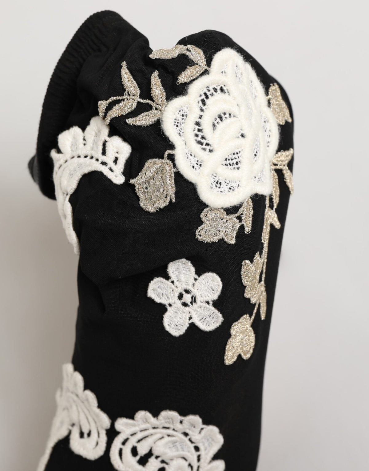 Step into unparalleled sophistication with Dolce & Gabbana's Black White Embroidered Jersey Stiletto Boots, where exquisite craftsmanship meets timeless elegance, perfect for the discerning fashionista.