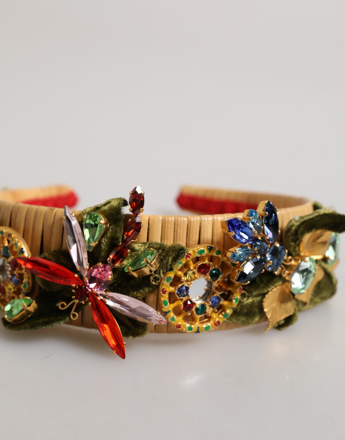 Discover the Dolce & Gabbana Multicolor Crystal Floral Velvet Crown Headband, a masterpiece of Italian craftsmanship that embodies luxury and elegance for every occasion.