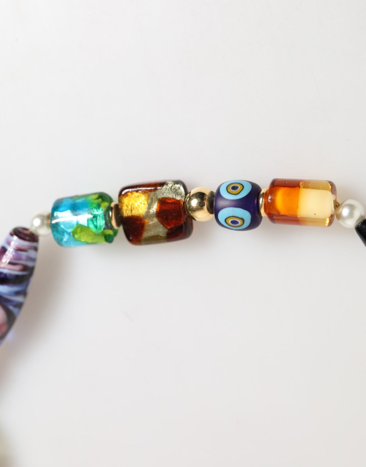 Elevate your style with the Dolce & Gabbana Multicolor Murano Glass Beads Brass Necklace, a luxurious statement piece that embodies exquisite Italian craftsmanship and artistic elegance.