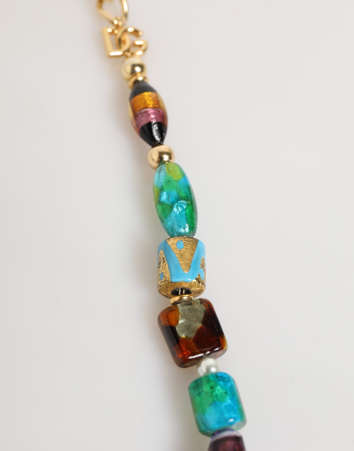 Elevate your style with the Dolce & Gabbana Multicolor Murano Glass Beads Brass Necklace, a luxurious statement piece that embodies Italian artistry and sophistication.