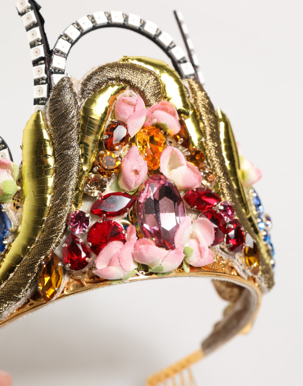 Indulge in the opulence of the Dolce & Gabbana Gold Brass Crystal Embellished Crown Tiara, a testament to exquisite Italian craftsmanship and timeless elegance.