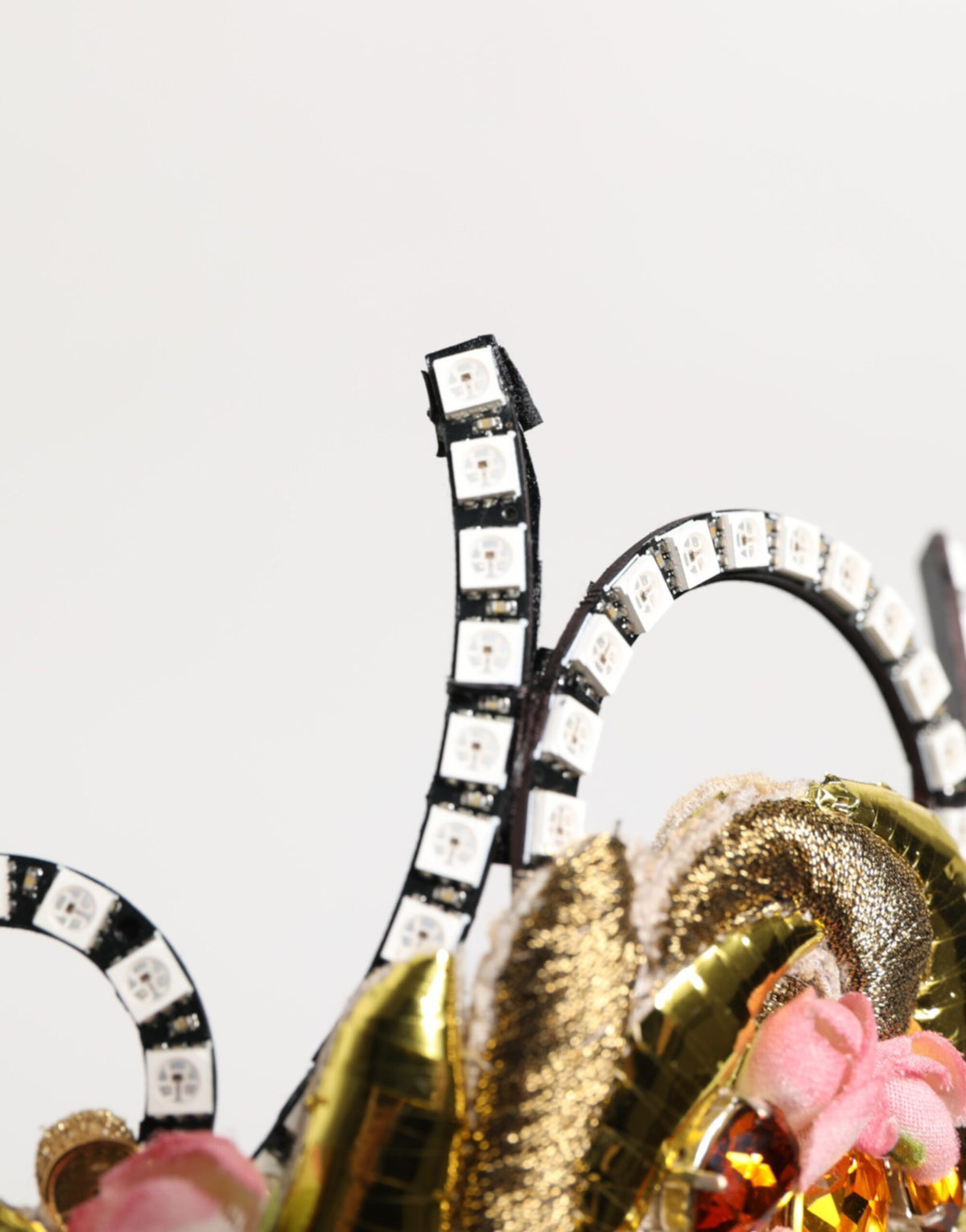 Discover the Dolce & Gabbana Gold Brass Crystal Embellished Crown Tiara, a masterpiece of Italian craftsmanship, designed to elevate your elegance and allure.