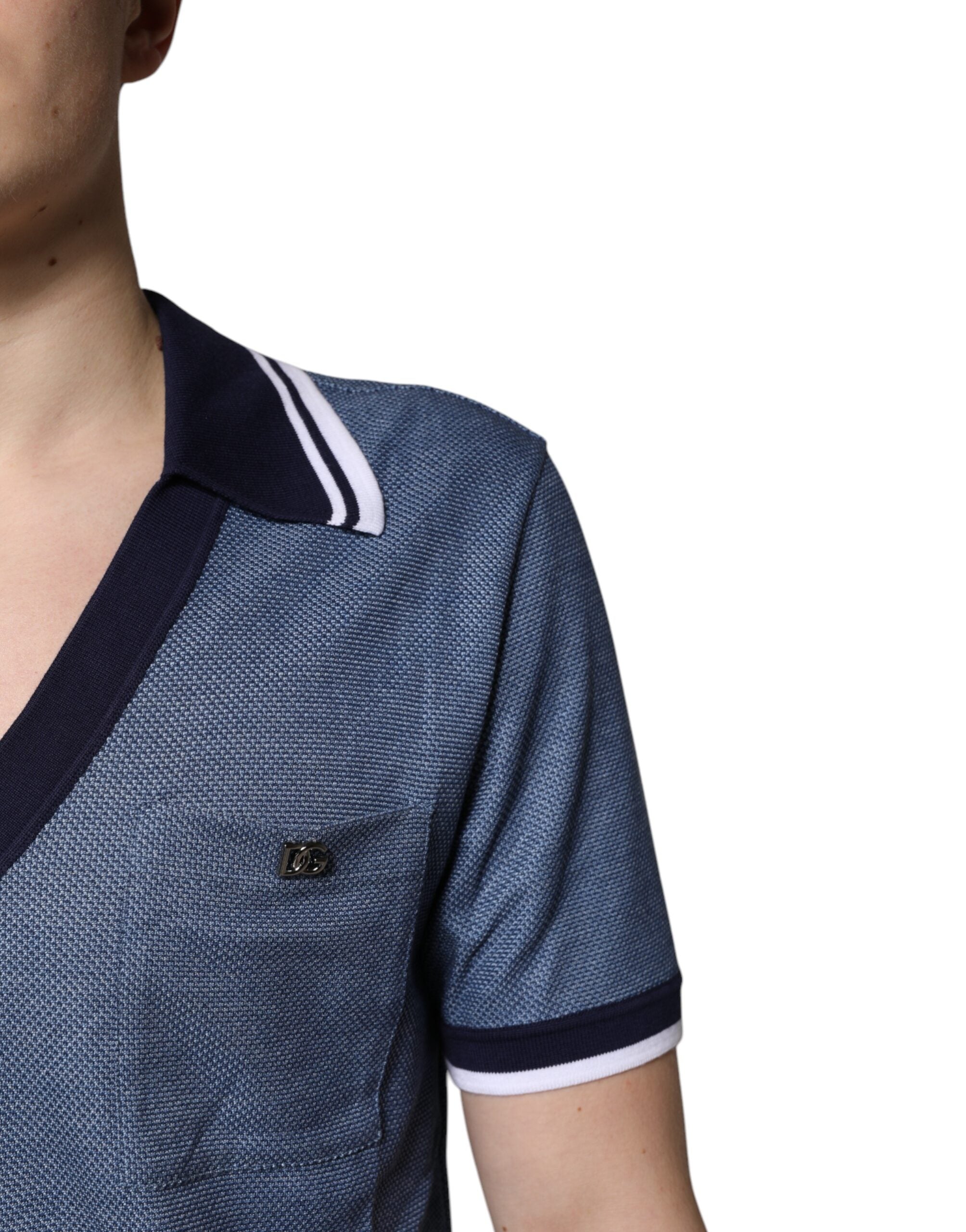 Experience the allure of Dolce & Gabbana's Blue Collared V-neck Silk Blend Polo T-shirt, where exquisite craftsmanship meets timeless elegance, perfect for the discerning individual.