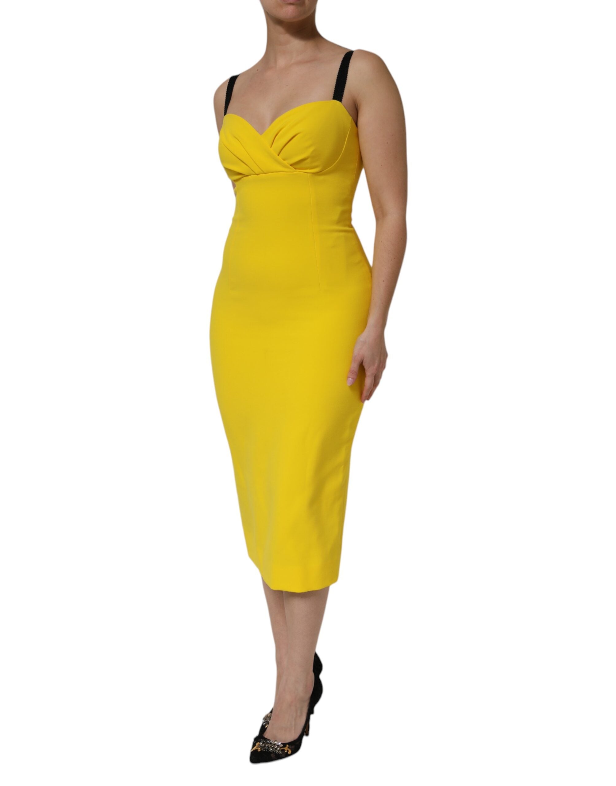 Indulge in the exquisite craftsmanship of the Dolce & Gabbana Yellow Sleeveless Sheath Midi Dress, a timeless piece that embodies luxury and sophistication for the discerning individual.