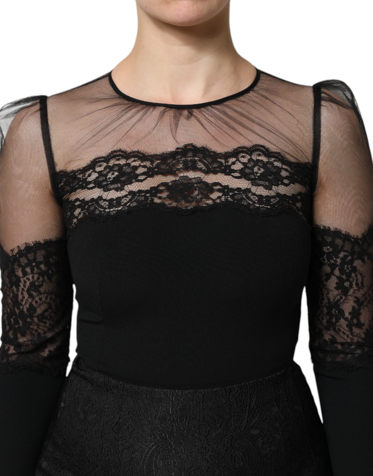 Indulge in the exquisite allure of the Dolce & Gabbana Black Lace Trim Nylon Tulle Sheath Midi Dress, a testament to Italian craftsmanship and timeless elegance.