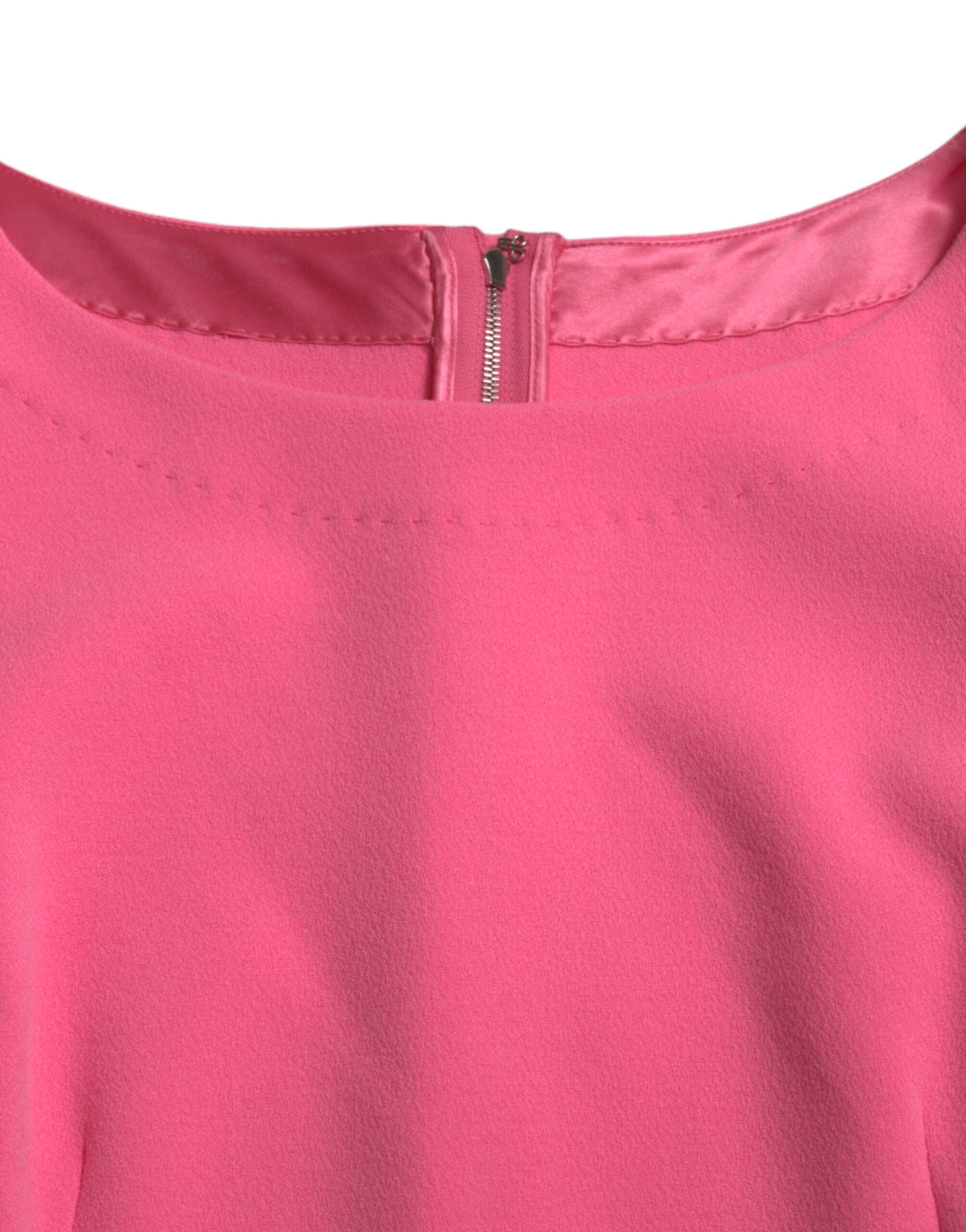 Experience the allure of the Dolce & Gabbana Pink Polyester Long Sleeves Sheath Midi Dress, a masterpiece of Italian craftsmanship that embodies timeless elegance and sophistication.