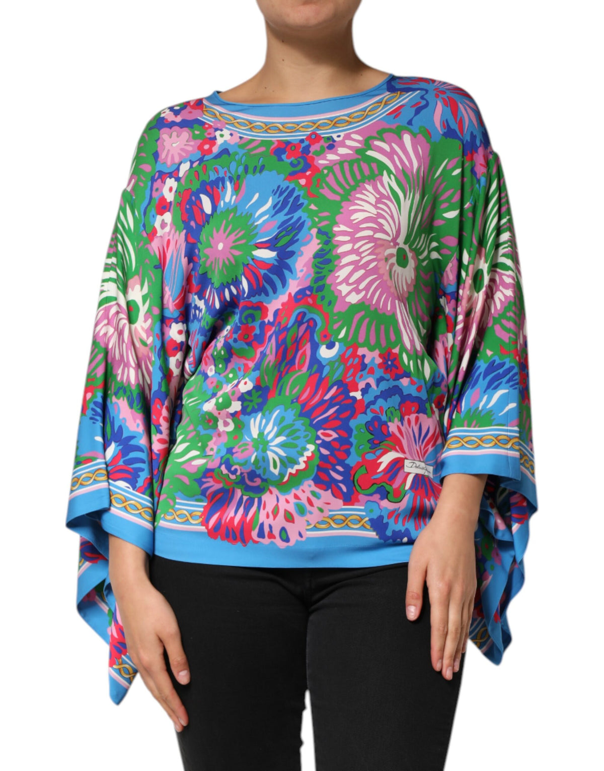 Elevate your wardrobe with the Dolce & Gabbana Multicolor Floral Printed Tunic Blouse, a silk masterpiece that embodies Italian artistry and luxurious comfort.