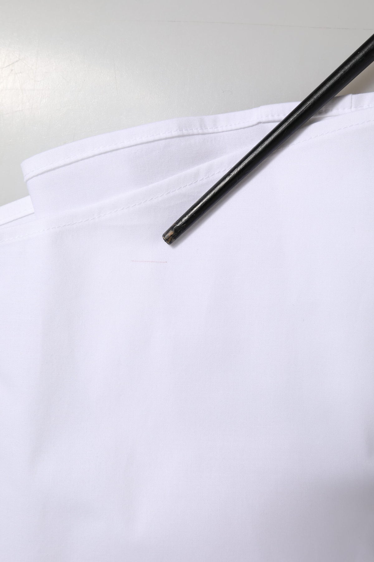 Elevate your wardrobe with the Dolce & Gabbana White Cotton Collared Dress Formal Shirt Top, a masterpiece of Italian craftsmanship that embodies timeless elegance and luxurious versatility.
