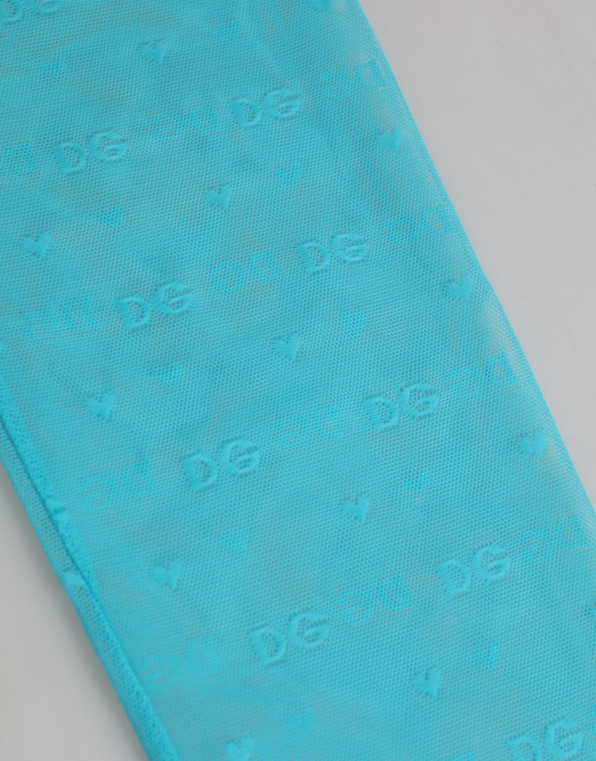 Elevate your wardrobe with Dolce & Gabbana's Light Blue Nylon Logo Lace Leggings, where exquisite craftsmanship meets sensual elegance, perfect for the modern connoisseur.