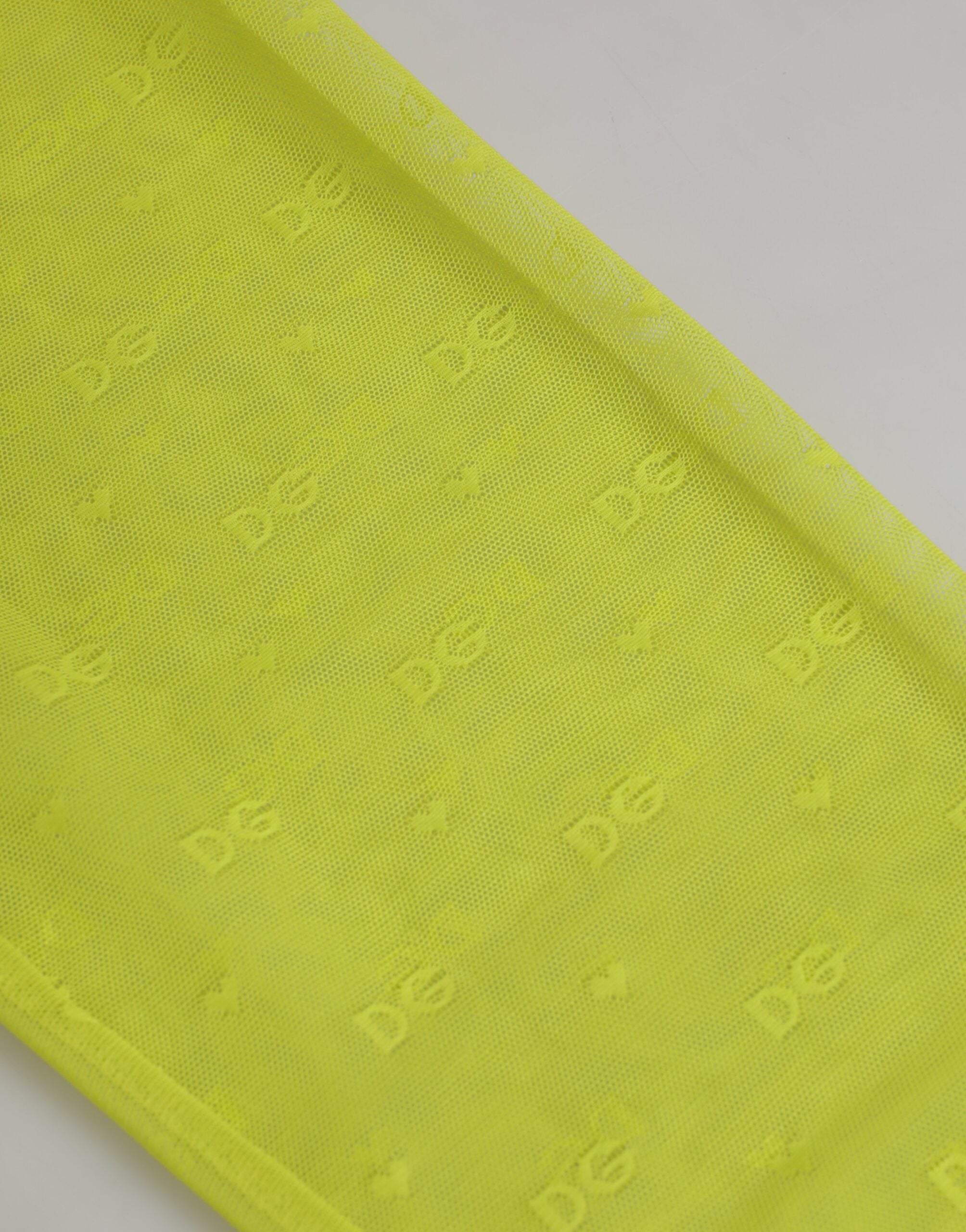 Indulge in the exquisite Dolce & Gabbana Neon Green Nylon Logo Lace Leggings, where luxurious craftsmanship meets sensual allure, perfect for the discerning individual.