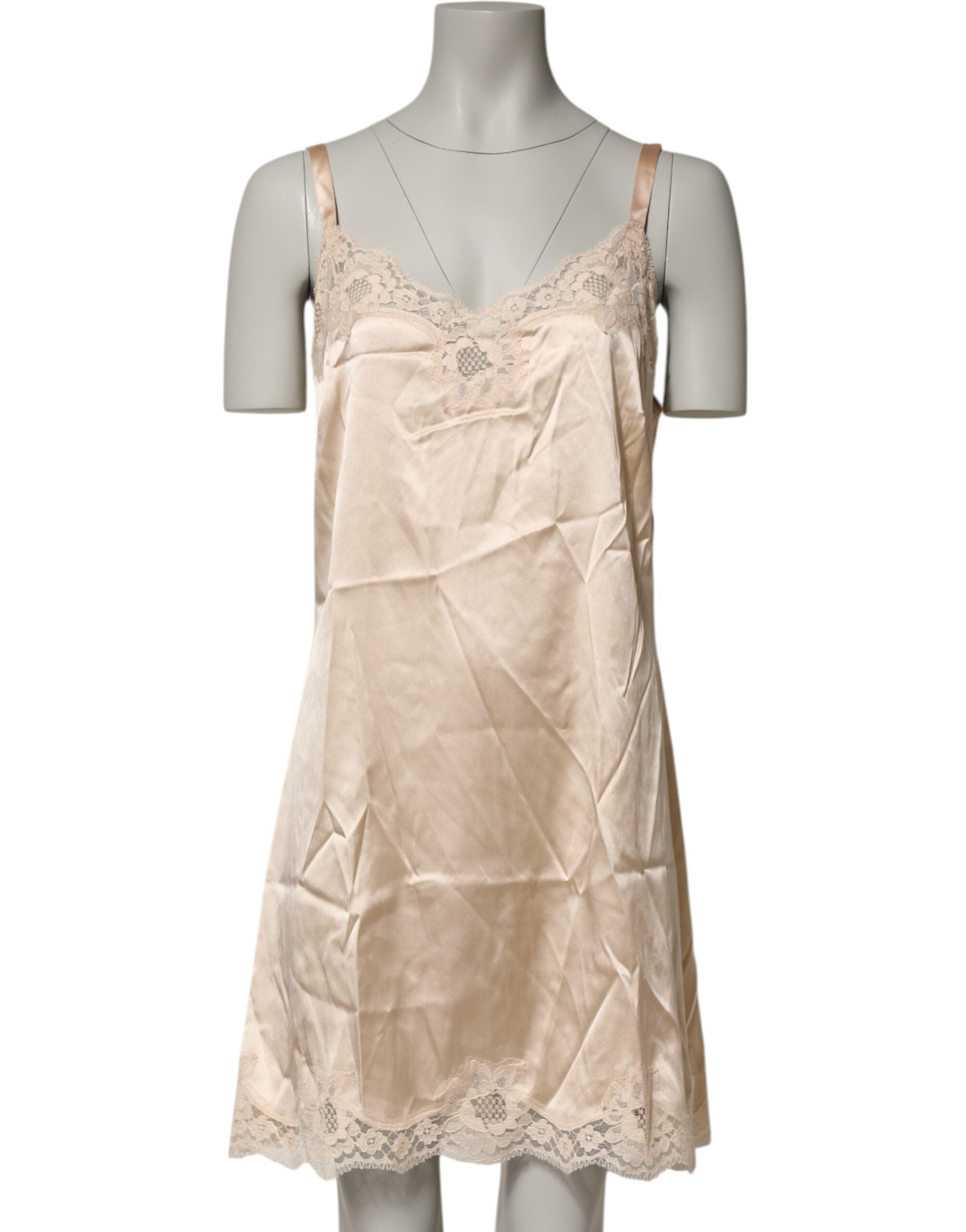 Indulge in the exquisite Dolce & Gabbana Nude Chemise, a silk blend masterpiece adorned with lace trim, celebrating sensual elegance and timeless allure.