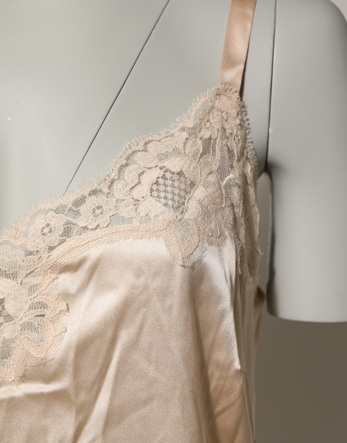 Indulge in the exquisite Dolce & Gabbana Nude Chemise, a silk blend masterpiece that embodies sensual elegance and timeless allure, perfect for celebrating your intimate moments.