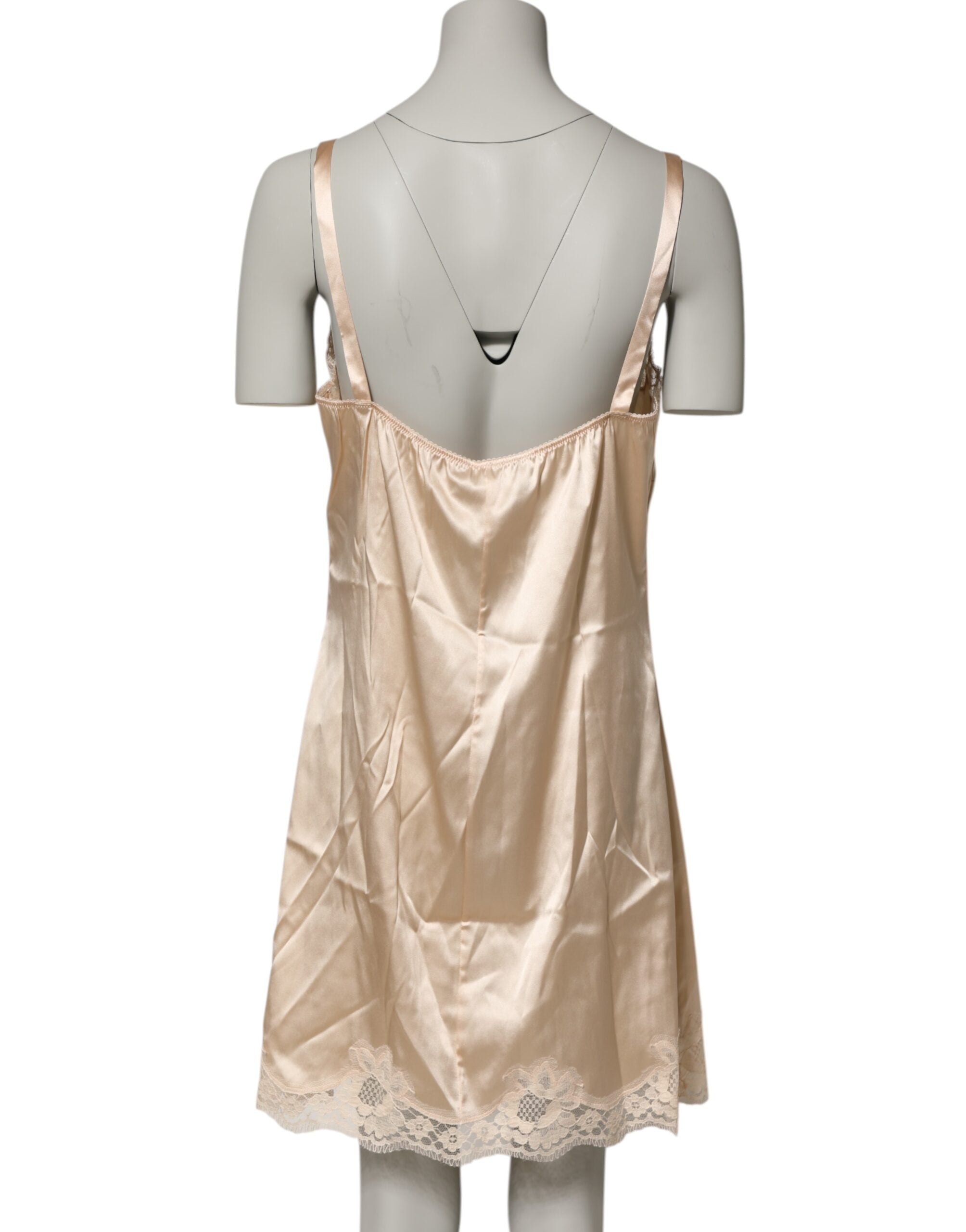 Indulge in the exquisite Dolce & Gabbana Nude Chemise, a silk blend masterpiece adorned with delicate lace, celebrating sensual elegance and timeless allure.