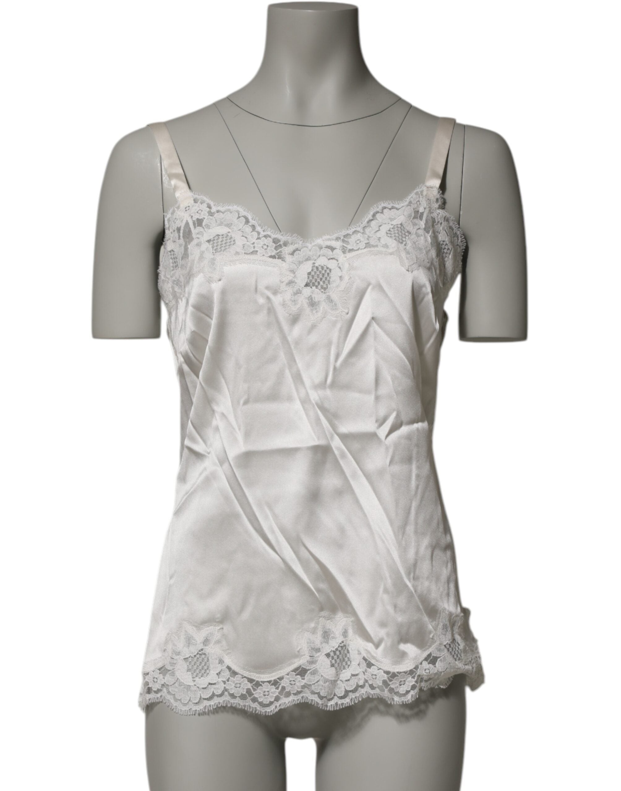 Experience the allure of Dolce & Gabbana's Off White Floral Lace Tank, a luxurious blend of silk and lace that embodies timeless elegance and sensual sophistication.