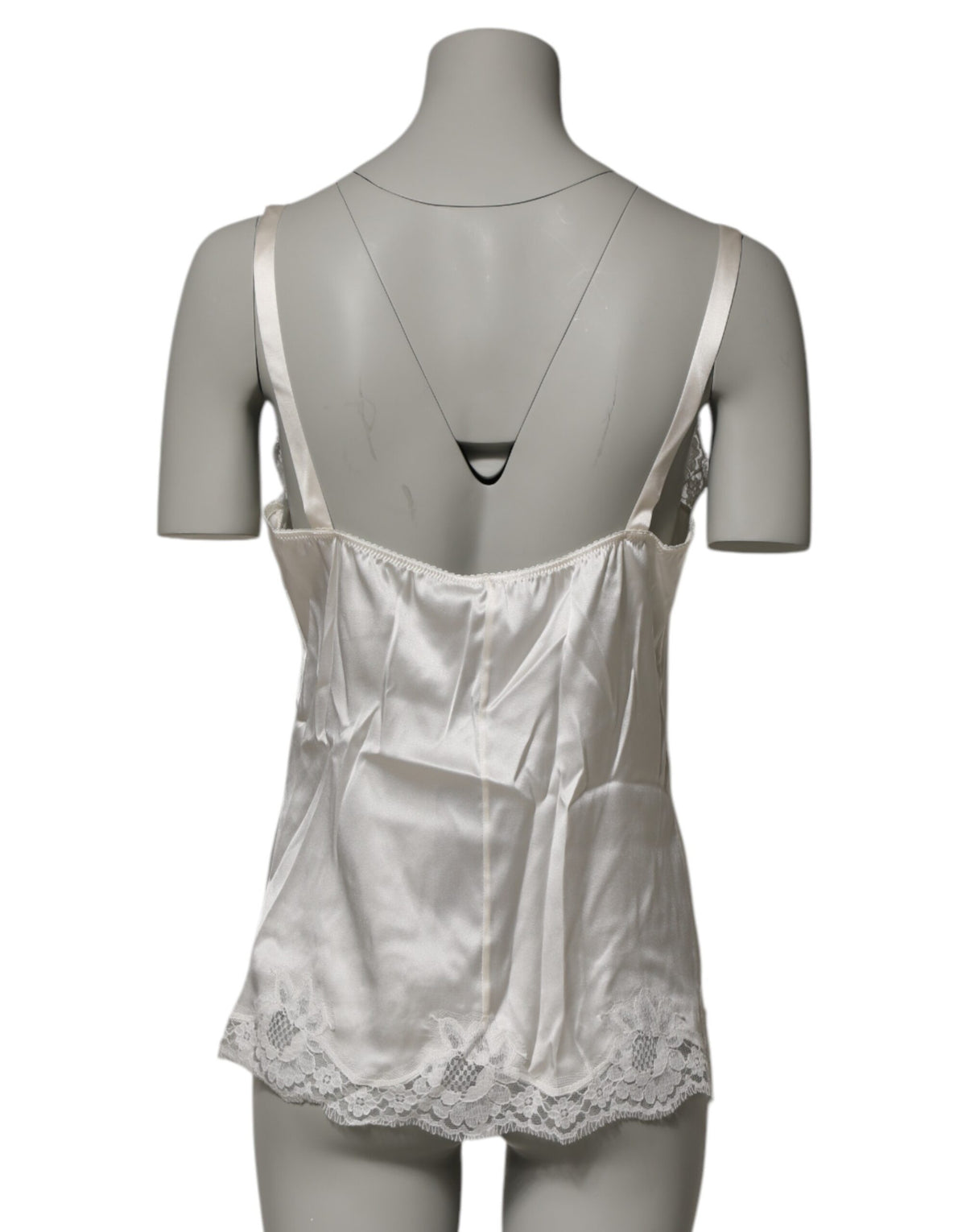 Elevate your allure with the Dolce & Gabbana Off White Floral Lace Tank, a luxurious blend of silk and lace that embodies timeless elegance and sophisticated sensuality.