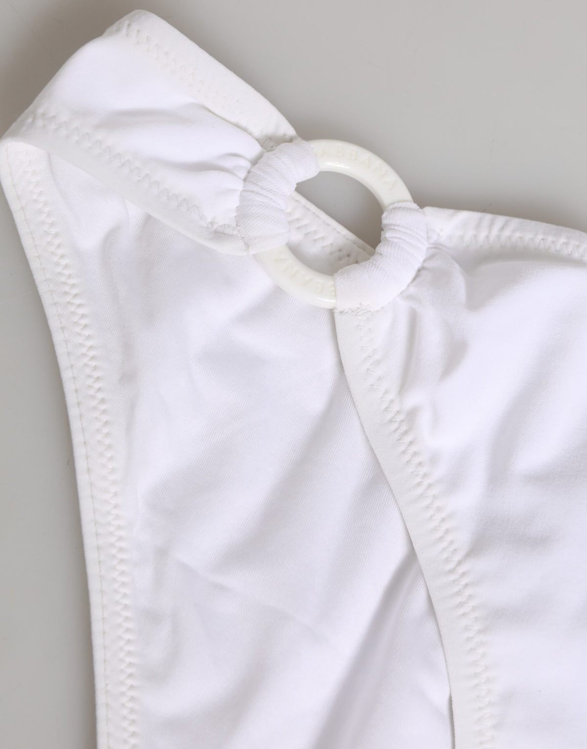 Elevate your summer wardrobe with the Dolce & Gabbana White Logo Swimsuit, a luxurious two-piece crafted from premium materials, embodying timeless sophistication and exquisite craftsmanship.