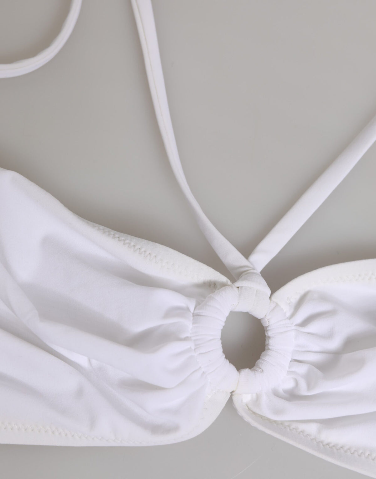 Discover the Dolce & Gabbana White Logo Swimsuit, a masterpiece of Italian craftsmanship that embodies timeless elegance and luxurious allure for the discerning individual.