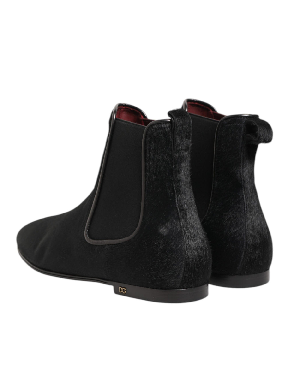 Indulge in the exquisite Dolce & Gabbana Black Leather Fur Chelsea Boots, where artisanal craftsmanship meets timeless elegance, elevating your style with luxurious sophistication.