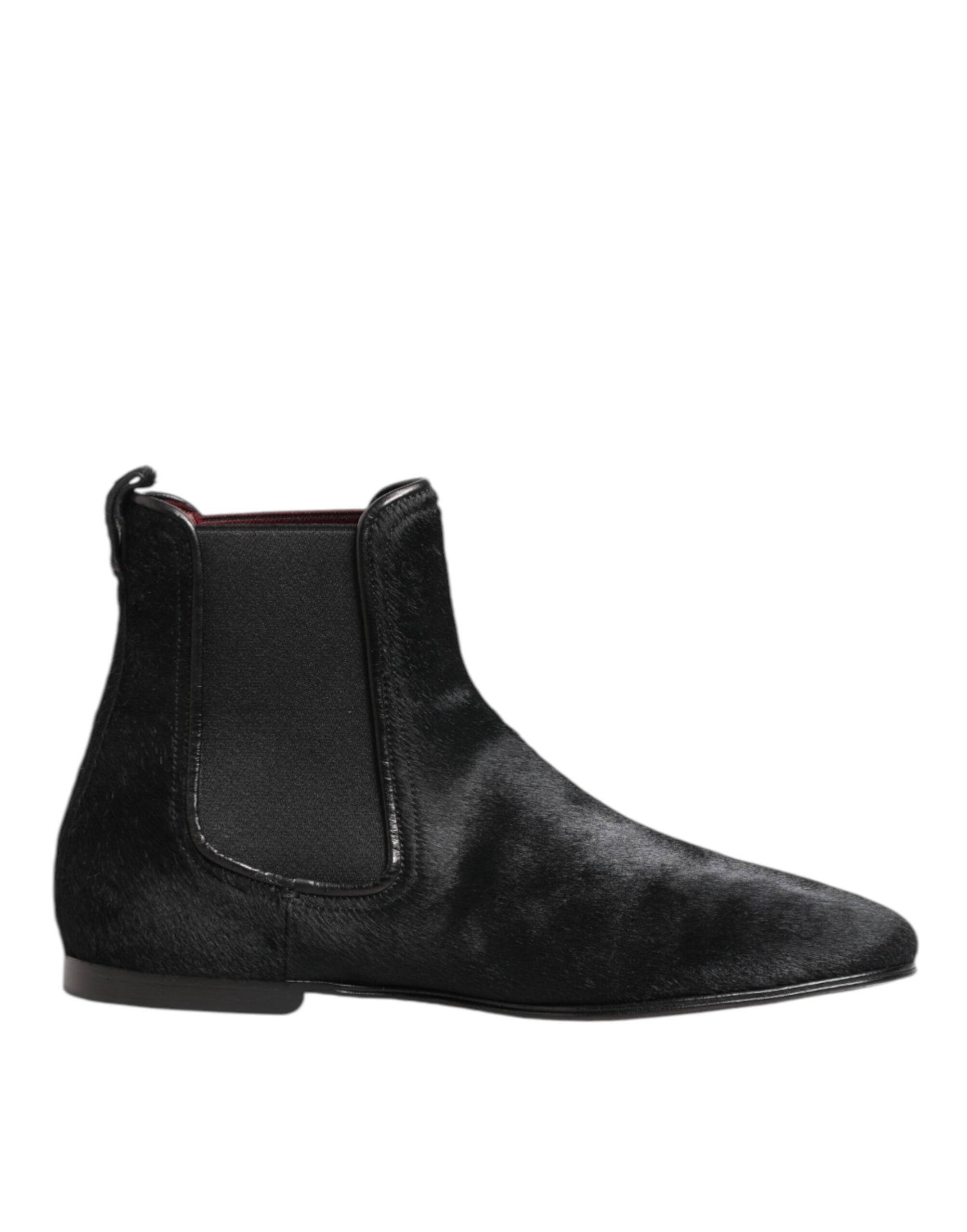Step into unparalleled luxury with Dolce & Gabbana's Black Leather Fur Chelsea Boots, where exquisite craftsmanship meets timeless elegance for the discerning connoisseur.