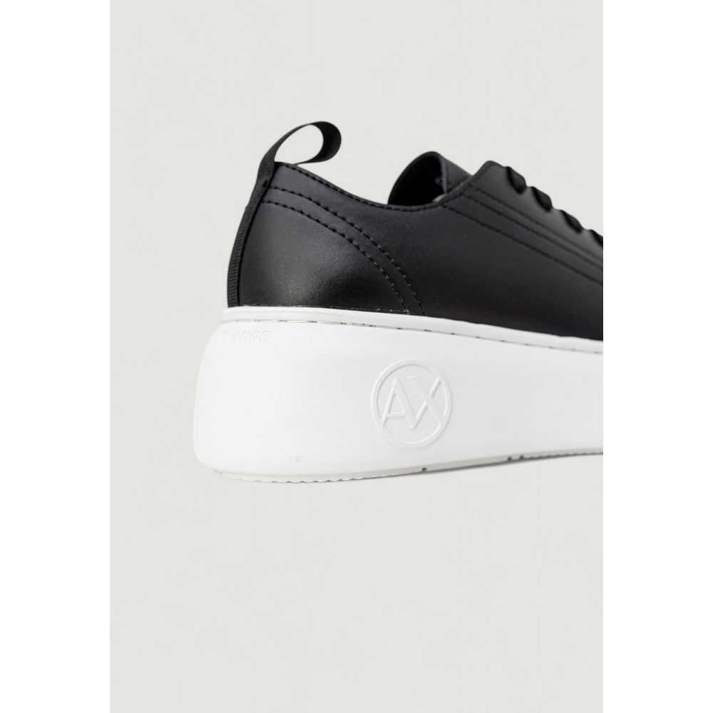 Step into the allure of Armani Exchange's Black Artificial Leather Low Top Sneakers, where eco-leather craftsmanship meets timeless luxury for the discerning fashionista.