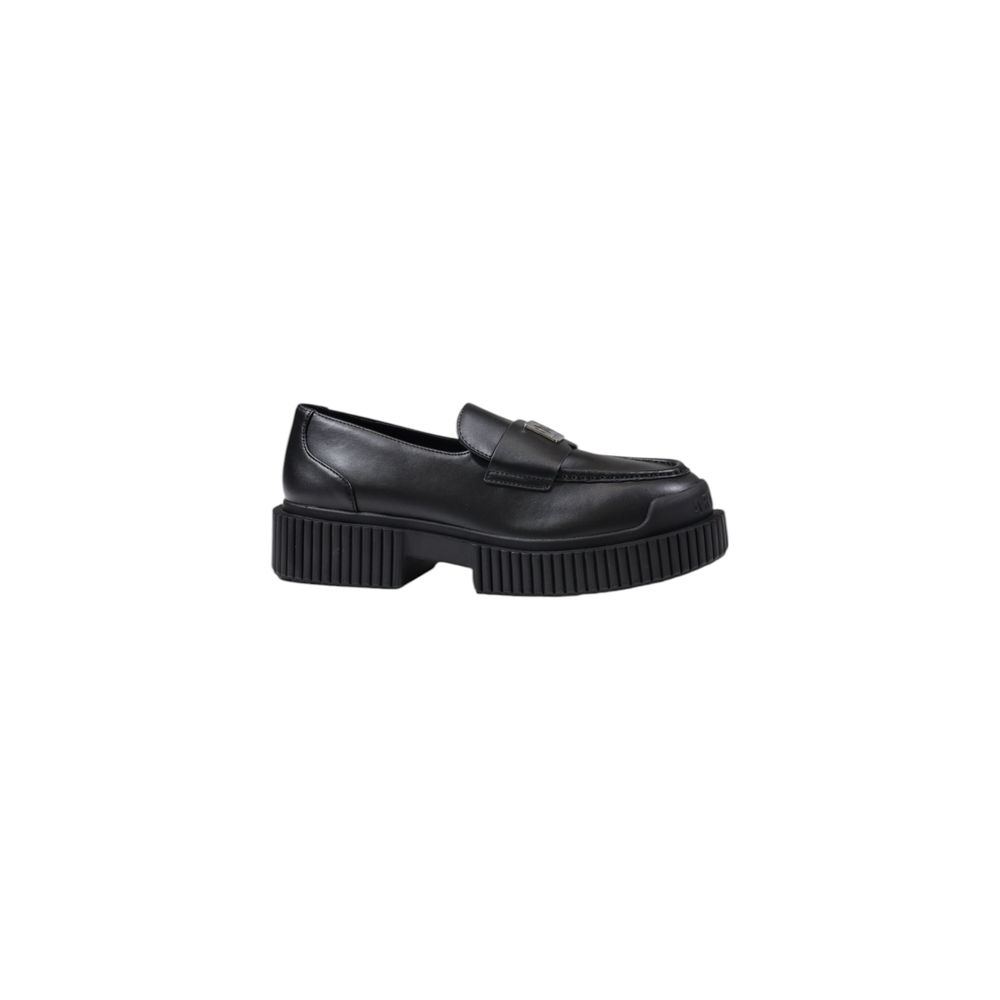 Step into a realm of sophistication with Armani Exchange Black Leather Platform Pumps, crafted from premium leather for timeless elegance and effortless allure.