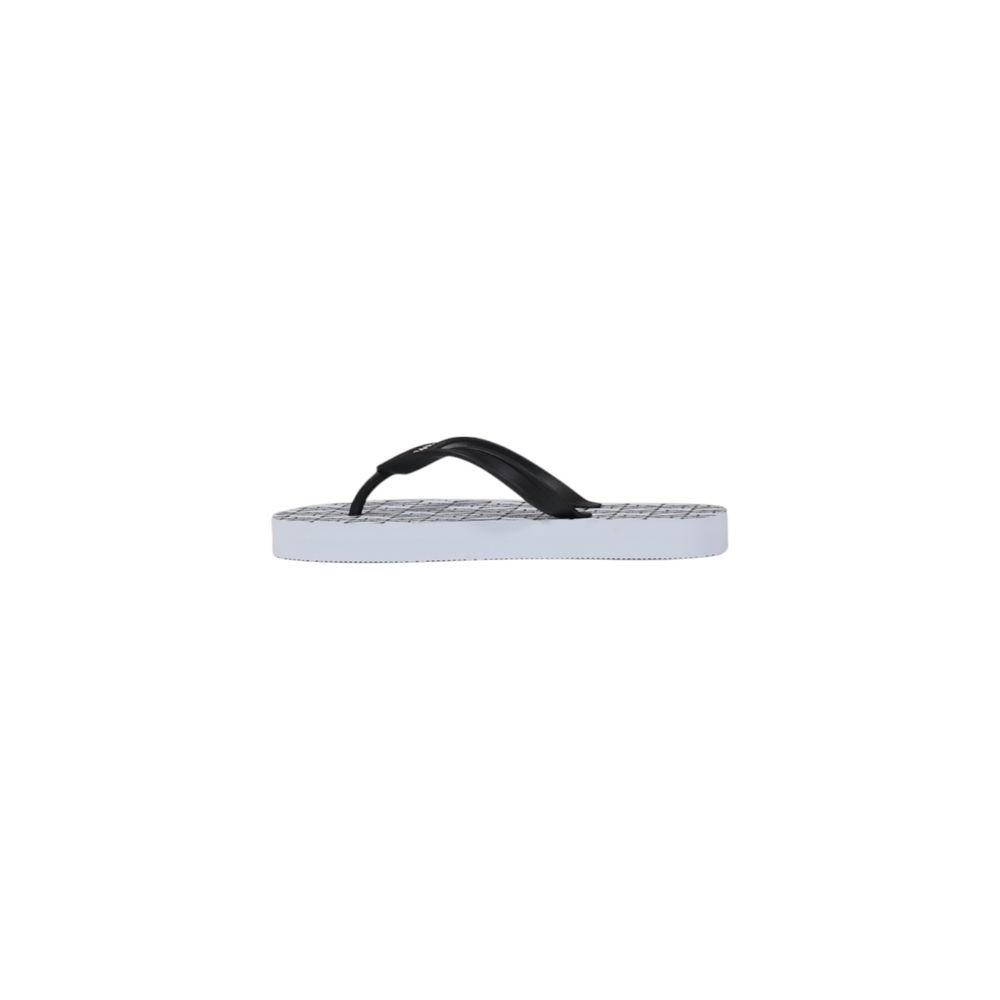 Elevate your summer style with Armani Exchange White Rubber Flip-Flop Sandals, crafted from premium rubber for unparalleled comfort and effortless elegance.