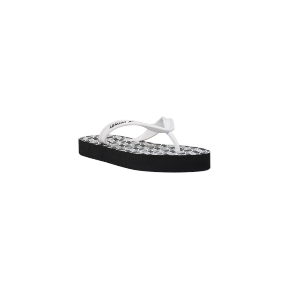 Elevate your summer elegance with Armani Exchange Black And White Rubber Flip-Flop Sandals, crafted from premium rubber for unparalleled comfort and sophistication.
