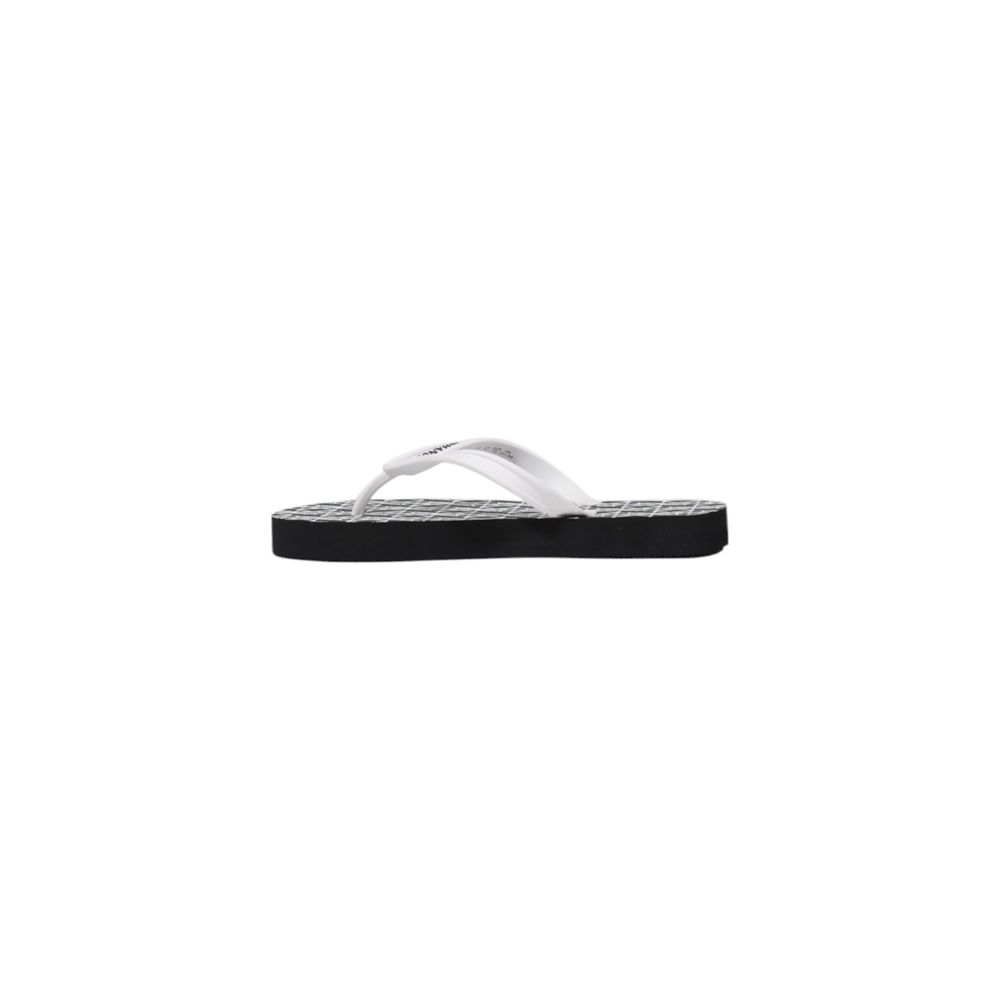 Elevate your summer allure with Armani Exchange Black And White Rubber Flip-Flop Sandals, where luxurious comfort meets minimalist elegance for the discerning individual.