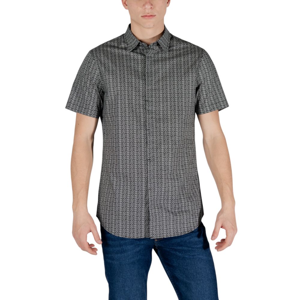 Elevate your wardrobe with the Armani Exchange Black Cotton Shortsleeve Shirt, a sophisticated blend of luxury and comfort, perfect for any occasion.