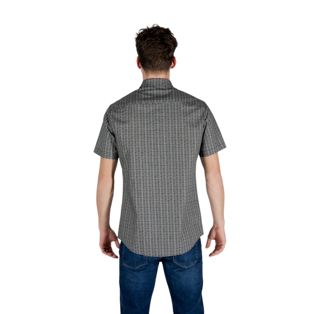 Elevate your wardrobe with the Armani Exchange Black Cotton Shortsleeve Shirt, a luxurious blend of refined design and comfort, perfect for any sophisticated occasion.