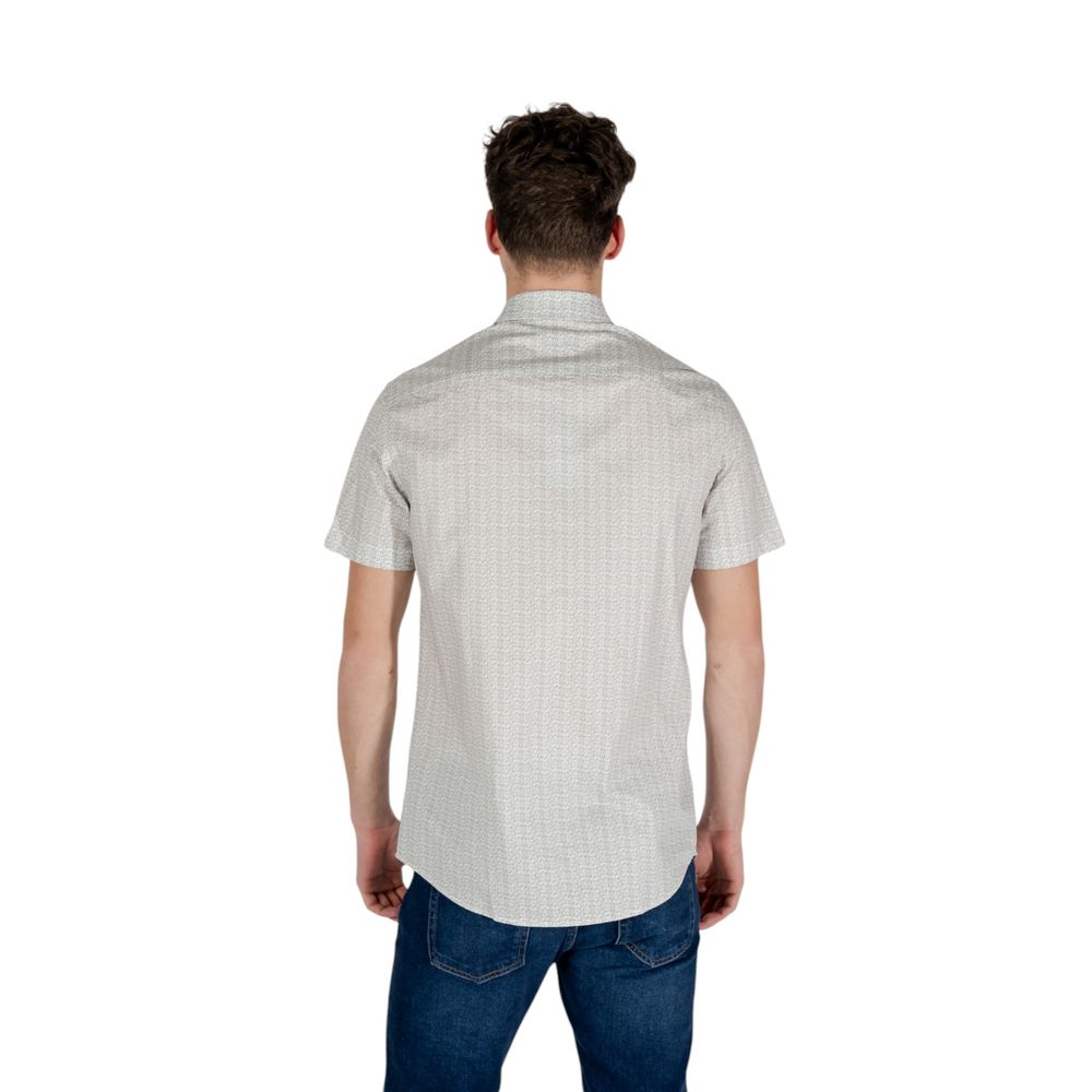 Elevate your wardrobe with the Armani Exchange Cream Cotton Shortsleeve Shirt, a luxurious blend of comfort and sophistication, perfect for the discerning individual.