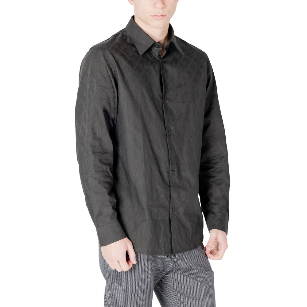 Elevate your wardrobe with the Armani Exchange Black Cotton Dress Shirt from the SS25 collection, a timeless blend of luxury and versatility crafted from premium cotton.