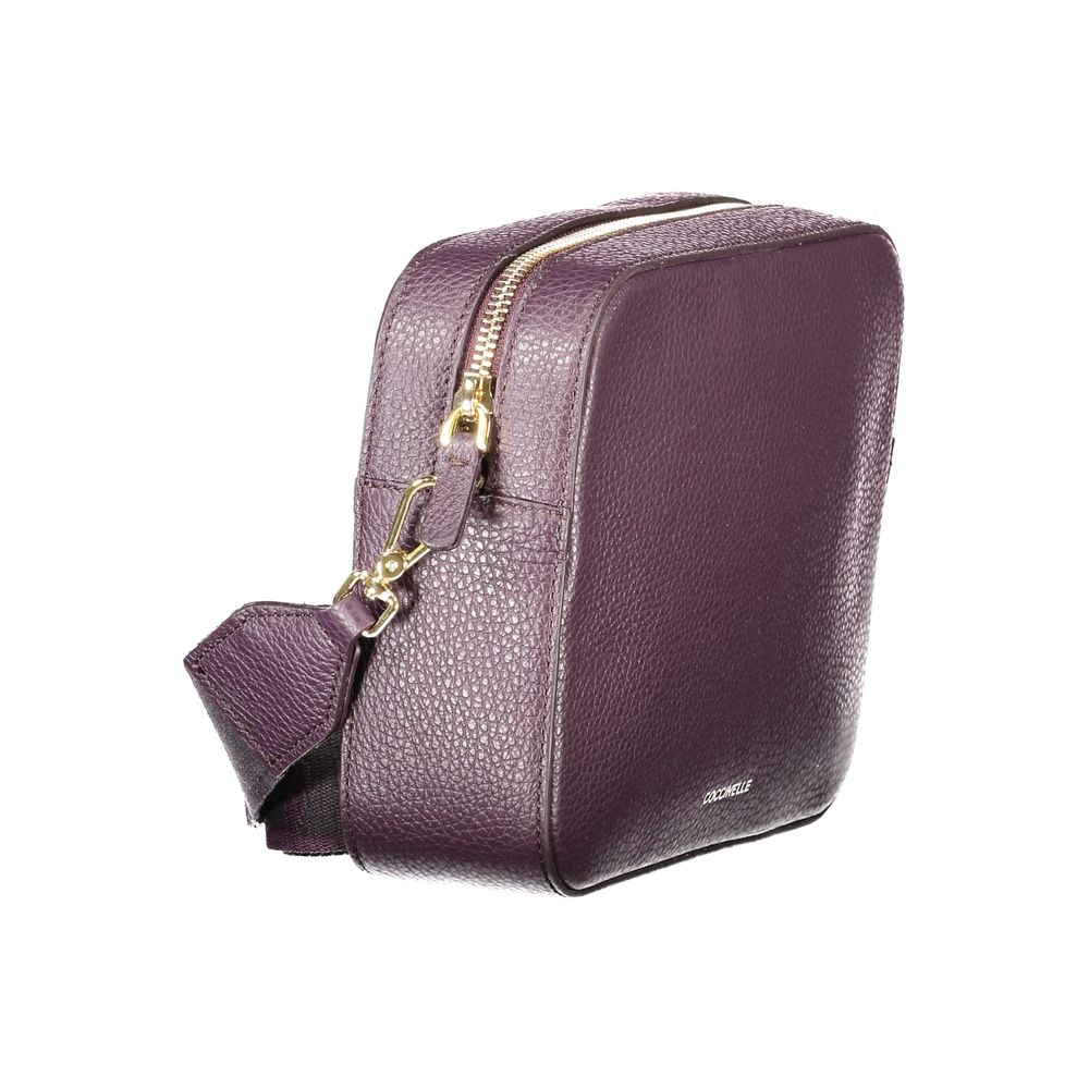 Discover the Coccinelle Purple Leather Mini Tebe Bag, a symbol of exquisite craftsmanship and timeless elegance, perfect for those who embrace luxury and individuality.