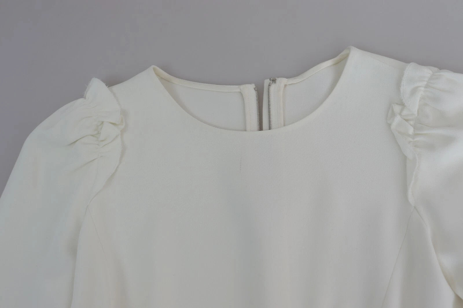 Elevate your wardrobe with the Dolce & Gabbana White Viscose Acetate Short Sleeve Blouse, a masterpiece of Italian craftsmanship that embodies timeless elegance and sophistication.
