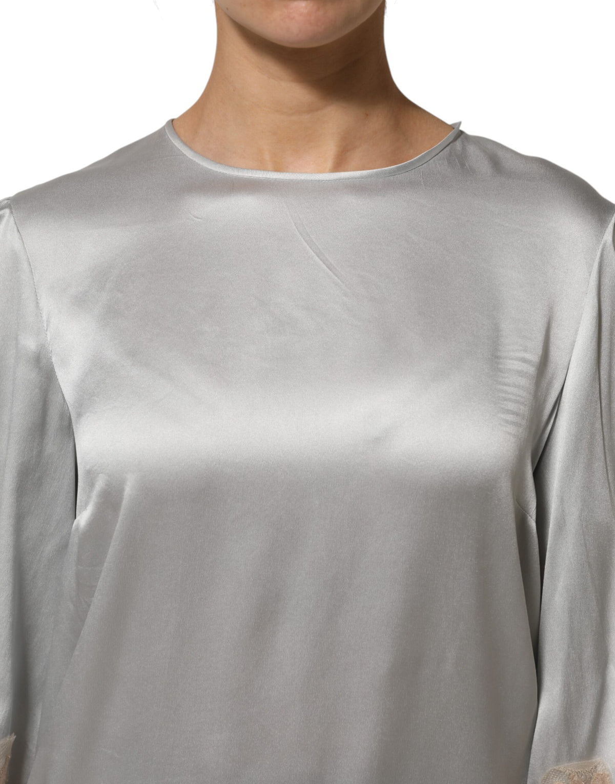 Indulge in the exquisite allure of Dolce & Gabbana's Gray Silk Satin Floral Lace Long Sleeve Top, a masterpiece of Italian craftsmanship that embodies timeless elegance and sophistication.