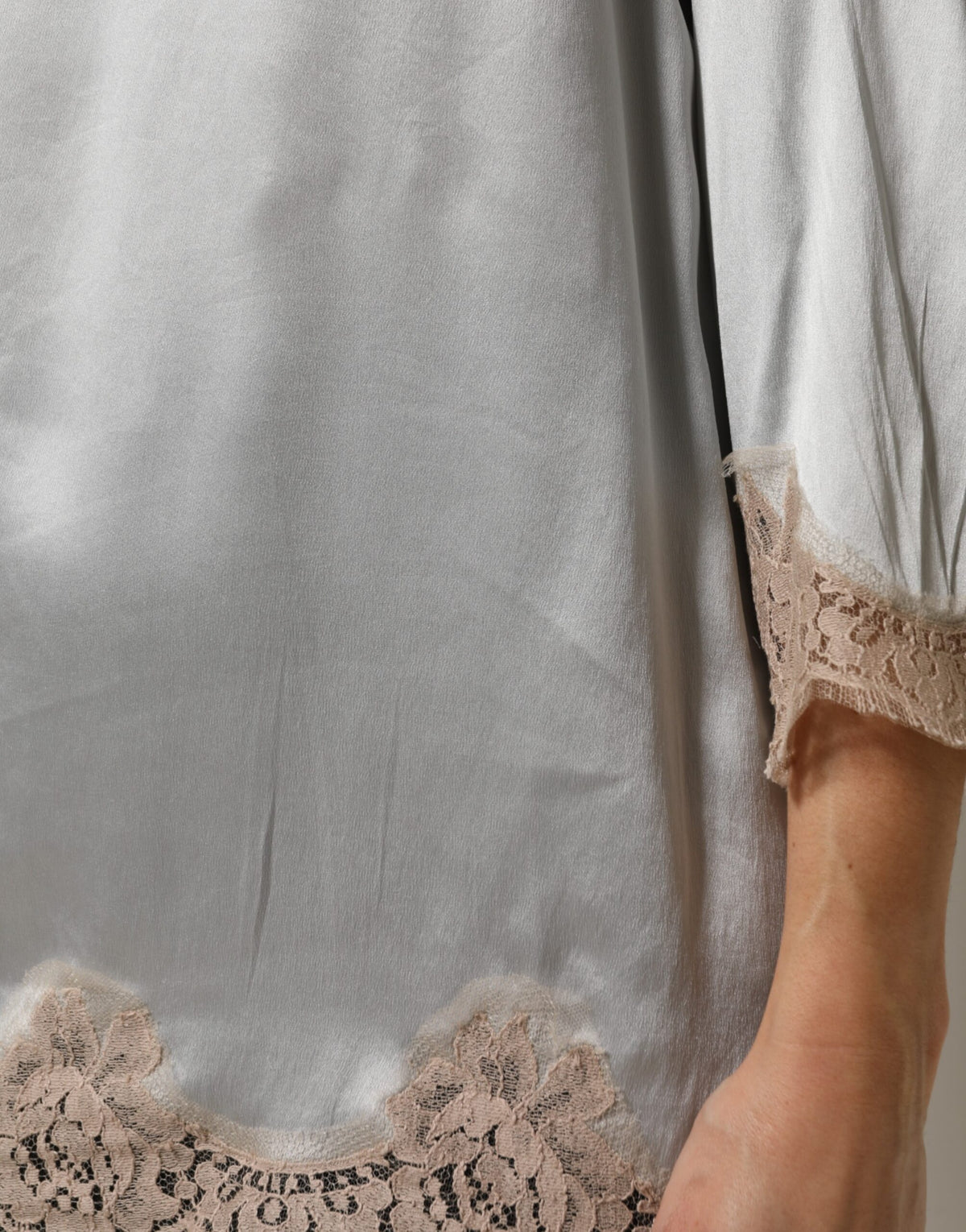 Indulge in the exquisite allure of Dolce & Gabbana's Gray Silk Satin Floral Lace Long Sleeve Top, a masterpiece of Italian craftsmanship that elevates your elegance.